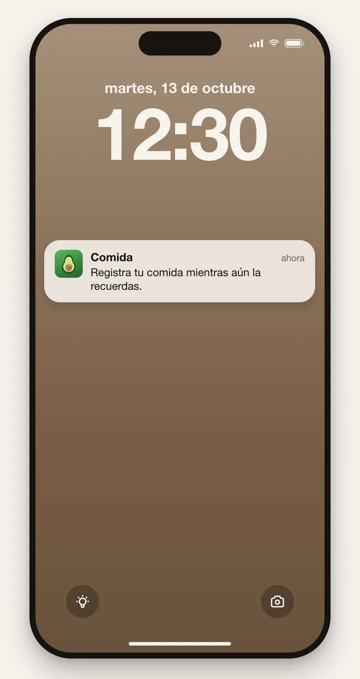 Una pantalla de bloqueo a las 12:30 con el recordatorio de AVO: registra tu comida mientras aún la recuerdas
